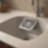 Close-up view of a kitchen sink drain showing signs of blockage.