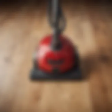 Top view of a high-quality vacuum cleaner on laminate wood flooring