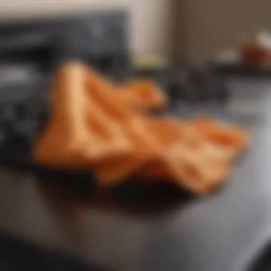 Efficient Cleaning Cloth in Action Cleaning cloth wiping stove top