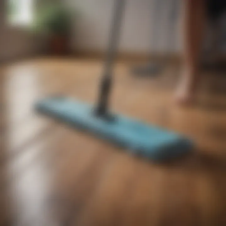 Person using a microfiber mop on wood floors