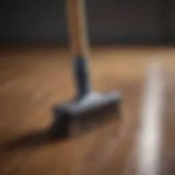 Wood laminate floor cleaning brush in action