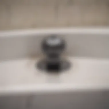 A close-up of a clogged bathtub drain