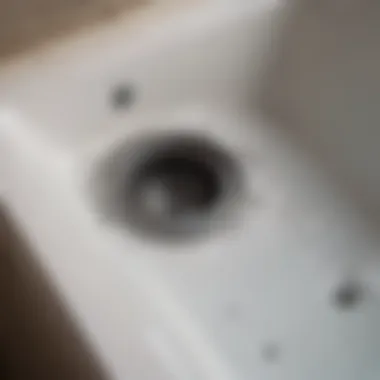 A close-up view of a tub drain showing potential blockage