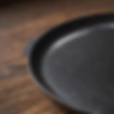 Detailed Surface of Seasoned Cast Iron Skillet Close-up of seasoned cast iron skillet surface