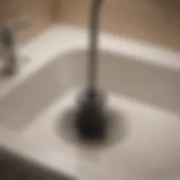 Unclogging laundry tub drain with plunger
